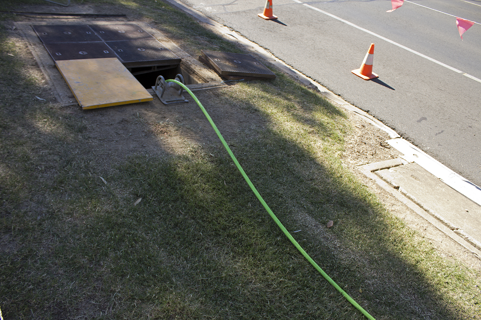 Fiber optic cable being laid in a trench
